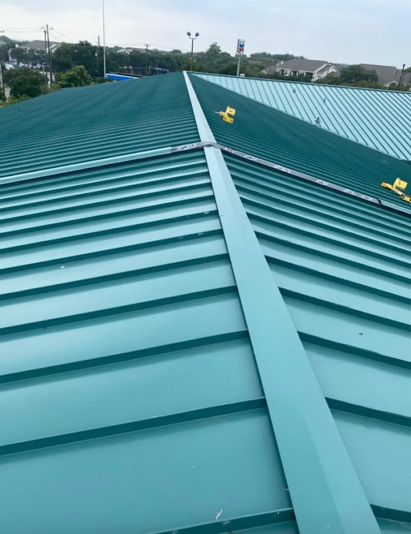 Green commercial metal roof ridge and valley for Metal Roof Repair in Altoona